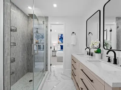 a white bathroom with a shower and a sink at Spacious home w heated pool jacuzzi in Hollywood