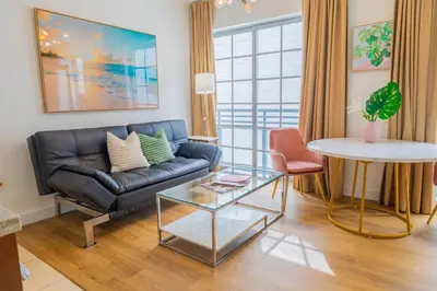 a living room with a couch and a table at 1-Bed Apt with rooftop pool Ocean Dr by the Beach B207 in Miami Beach