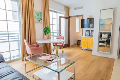 a living room with a couch and a table at 1-Bed Apt with rooftop pool Ocean Dr by the Beach B207 in Miami Beach