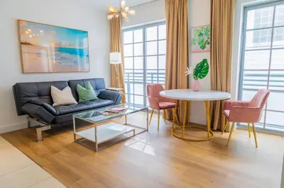 a living room with a couch and a table at 1-Bed Apt with rooftop pool Ocean Dr by the Beach B207 in Miami Beach