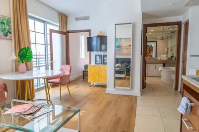 a living room with a table and a dining room at 1-Bed Apt with rooftop pool Ocean Dr by the Beach B207 in Miami Beach