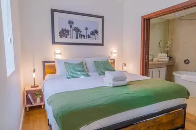 a bedroom with a bed and a bathroom with a tub at 1-Bed Apt with rooftop pool Ocean Dr by the Beach B207 in Miami Beach