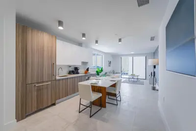 a kitchen and dining room with a table and chairs at Prime location: Luxury Condo at brickell in Miami