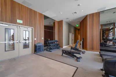a gym with treadmills and exercise equipment in a building at Prime location: Luxury Condo at brickell in Miami