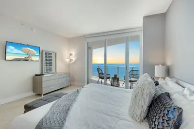 a bedroom with a bed and a view of the ocean at Oceanview Luxury 3BR Sky Home Amaizing Pool in Hollywood
