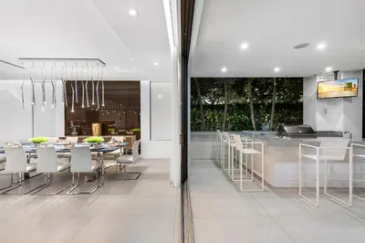 a kitchen and dining room with a table and chairs at Villa Celine in Fort Lauderdale