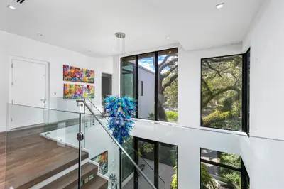 a staircase in a house with large windows at Villa Celine in Fort Lauderdale