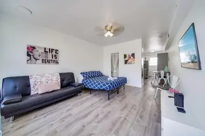 a living room with a couch and a chair at Ocean Drive Prime Apt w/2 Queen-Beds, South Beach in Miami Beach
