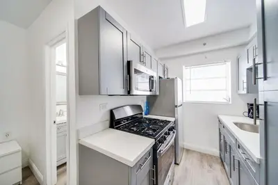 a kitchen with a stove and a refrigerator at Ocean Drive Prime Apt w/2 Queen-Beds, South Beach in Miami Beach