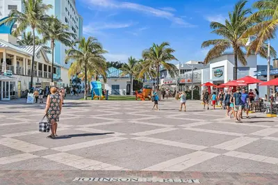 a group of people walking around a shopping center at Hollywood Beach Getaway Executive Studio Suite in Hollywood