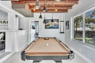 a pool table in a room with white walls at 3br Villa W Fire Pit By Hard Rock Hotel & Casino in Fort Lauderdale