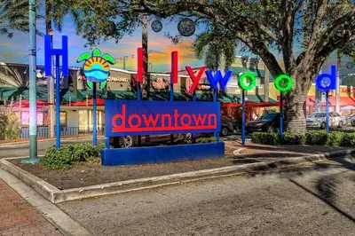 a sign that says downtown in front of a building at Hollywood Blvd Near The Beach 