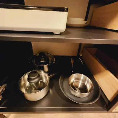 two pots and pans sitting on top of a stove at Private Home Studio Central Located in Miami 1 in Opa-locka