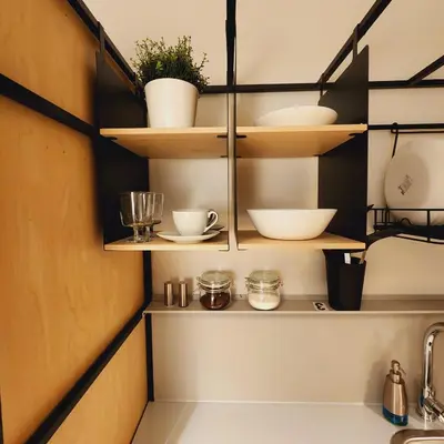 a kitchen with wooden shelves and a sink at Private Home Studio Central Located in Miami 1 in Opa-locka