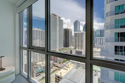 a view of a city skyline from a window at 227-2500FU DOWNTOWN MIAMI 1 BEDROOM CONDO in Miami