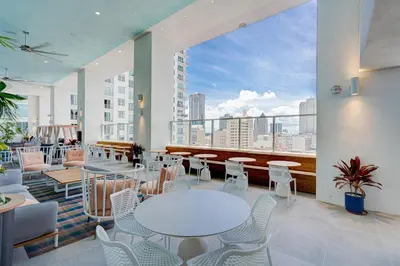 a room with tables and chairs and a large window at 227-2500FU DOWNTOWN MIAMI 1 BEDROOM CONDO in Miami