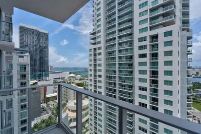 an apartment balcony with a view of buildings at 227-2500FU DOWNTOWN MIAMI 1 BEDROOM CONDO in Miami