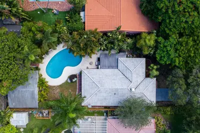 an aerial view of a house with a swimming pool at Charming Cottage 1BR, Pool, Victoria Park in Fort Lauderdale