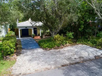 a house with a garage and a driveway at Family Home 2BR Heated Pool, Victoria Park in Fort Lauderdale
