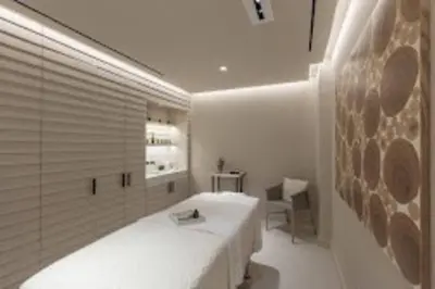 a bedroom with a large white bed and a desk at Oceanview 1 Hotel & Homes 1 Bedroom 1 and Half Bathrooms Luxe Condo with Balcony in Miami Beach