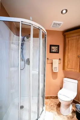 a bathroom with a shower and a toilet at Le Cartier Apartments Sunny Isles in Sunny Isles Beach