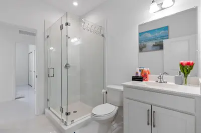 a bathroom with a shower and a toilet and a sink at Miami Oasis Villa, Your Luxury Haven in Tamiami