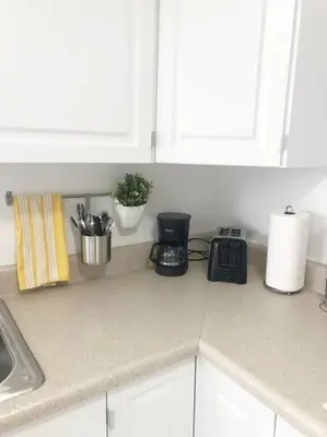 a kitchen counter top with a sink and a counter top at Cozy and sweet home in Miami