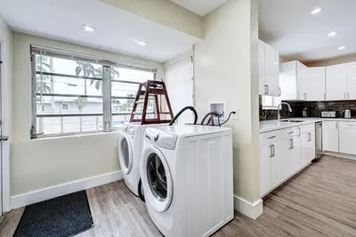 a white laundry room with a washer and dryer at Luxury Villa WALK 5 minutes to Hollywood Beach in Hollywood