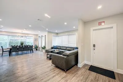 a living room with a couch and a table at Luxury Villa WALK 5 minutes to Hollywood Beach in Hollywood