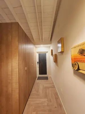 a hallway with wooden walls and a hallway with a door at Private Home Studio Central Located in Miami 2 in Opa-locka