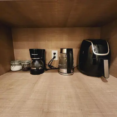 a group of appliances sitting on top of a counter at Private Home Studio Central Located in Miami 2 in Opa-locka