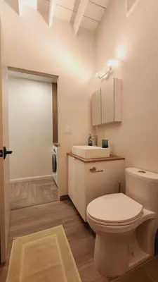 a bathroom with a white toilet and a sink at Private Home Studio Central Located in Miami 2 in Opa-locka