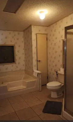 a bathroom with a tub and a toilet and a sink at 1233 Apartment 1 Miami in Tamiami