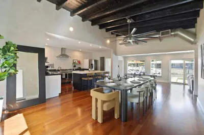 a kitchen and dining room with a table and chairs at Waterfront - Kayak & Paddleboards - Firepit - Pool in Miami