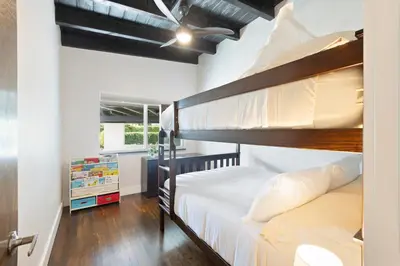 a bedroom with two bunk beds in it at Waterfront - Kayak & Paddleboards - Firepit - Pool in Miami