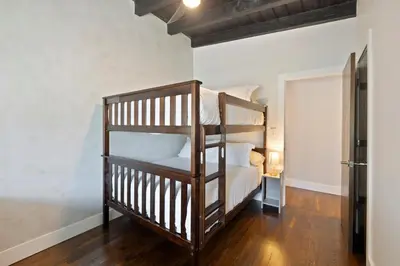 a bedroom with two bunk beds in a room at Waterfront - Kayak & Paddleboards - Firepit - Pool in Miami