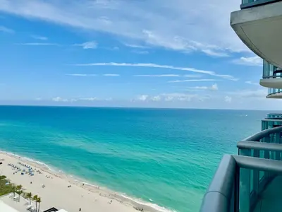 a view of the beach from the balcony of a building at Marena Resort in Sunny Isles Beach