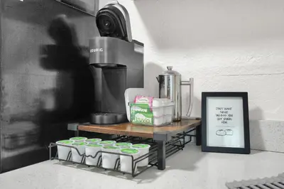 a shelf with a bunch of containers on a table at Suite Azul Miami - Private Guest Suite with Patio, Free Parking, Near Wynwood and Beaches in Miami