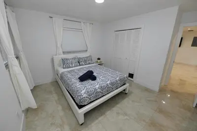 a bedroom with a bed with a hat on it at N61 in Hollywood