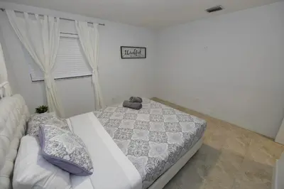 a bedroom with a bed and a window at N61 in Hollywood