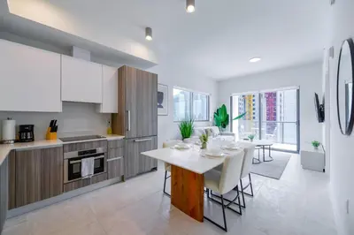 a kitchen and dining room with a table and chairs at Condo with Amazing Views in the Heart of Brickell in Miami