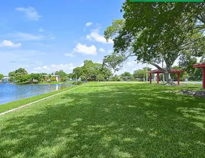 a green park with a tree and a gazebo at 1233 Apartment 2 Miami in Tamiami