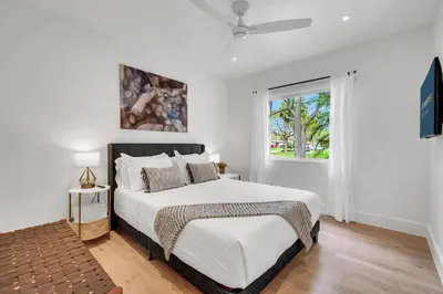 a bedroom with a bed and a window at Samadhi - NEW 15 min drive to Ultra, by Newman Hospitality in Miami Shores