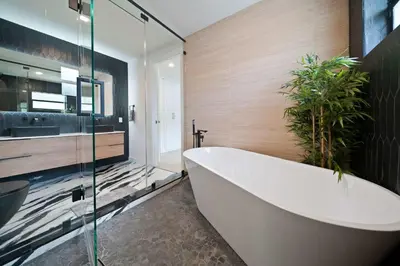 a bathroom with a large tub and a plant at New Luxury Villa Delilah Biscayne Park in Biscayne Park