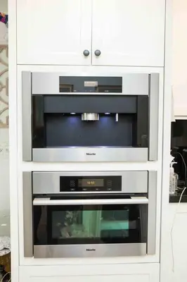 a white cabinet with two microwaves and a microwave at Pool! Best location! Steps to the water! Kid friendly! in Miami