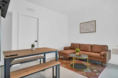 a living room with a couch and a table at Villa 2 in Miami in Miami