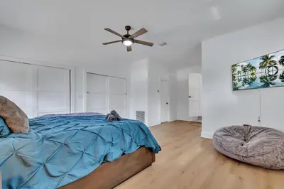 a bedroom with a bed and a ceiling fan at Gated Villa Blanca 5BR 3BA with Heated Pool & BBQ in Miami