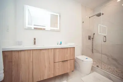 a bathroom with a toilet and a sink and a shower at Comfortable and broad apartment in O-Reserve near on the beach in Sunny Isles Beach