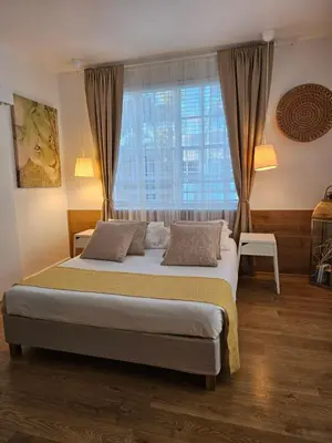 a bedroom with a large bed and a window at Bright 1BedRoom RENOVATED NEAR THE BEACH (4PPL) in Miami Beach