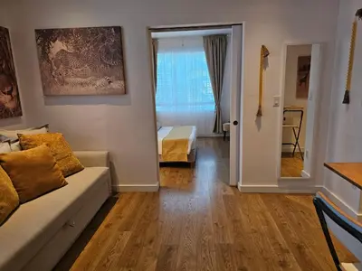 a living room with a couch and a window at Bright 1BedRoom RENOVATED NEAR THE BEACH (4PPL) in Miami Beach